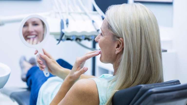 woman at the prosthodontist in aurora