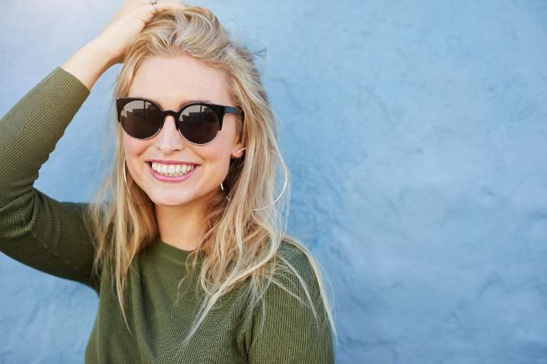 young woman with a big smile in aurora co