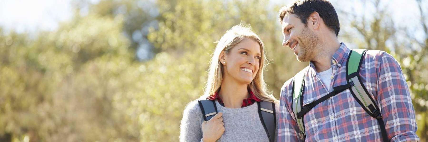 young couple hiking in aurora co