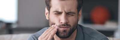 man with a broken tooth in aurora co